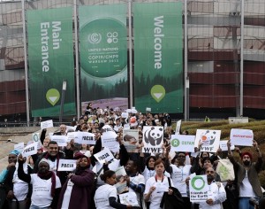 Members of NGOs walk out of United Nations Climate Change Conference COP 19 in Warsaw on November 21, 2013. They protested as they claim were 'on track to deliver virtually nothing'    AFP PHOTO / JANEK SKARZYNSKI
